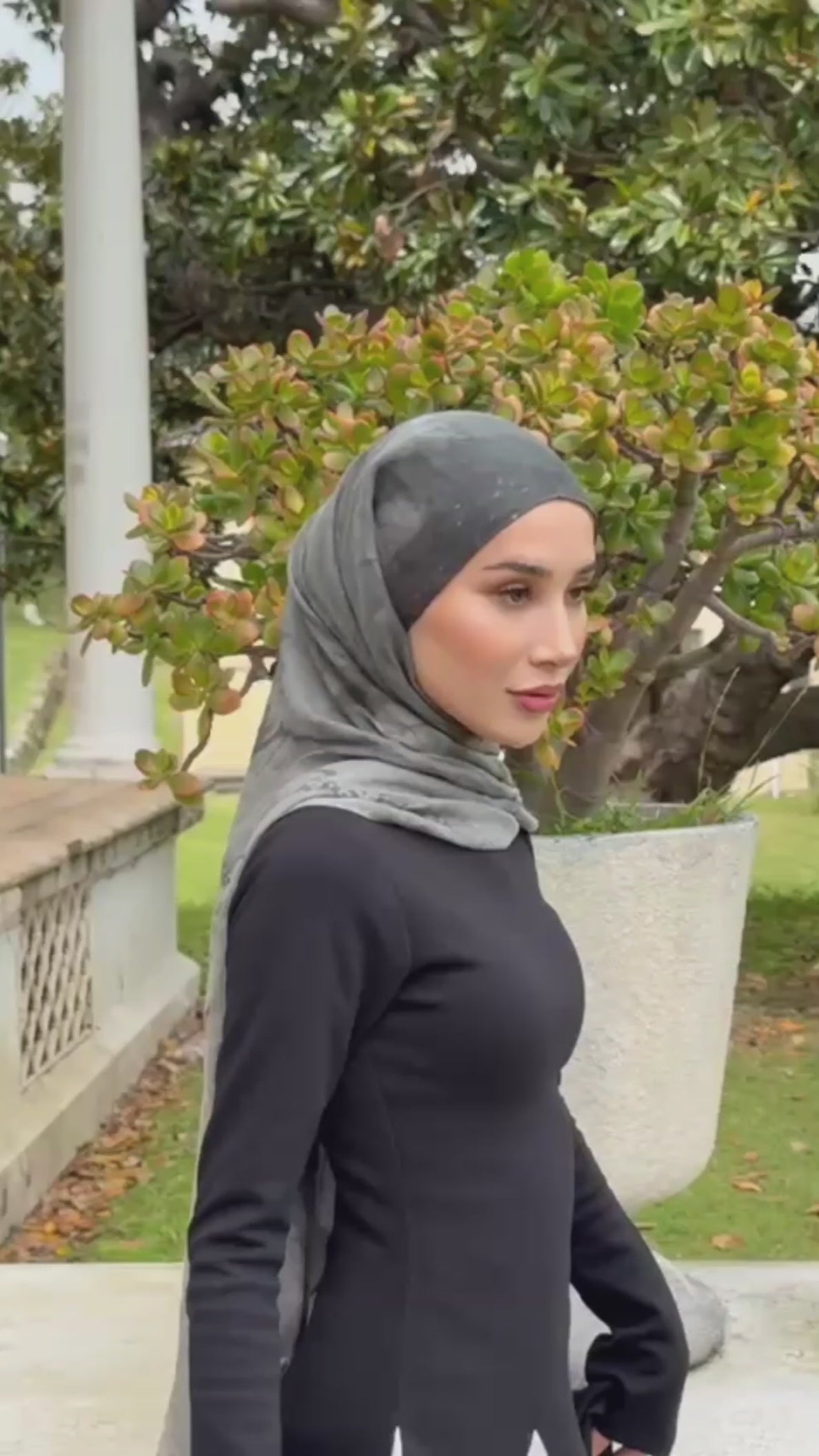 Load video: modest hijabi wearing a pattern shawl